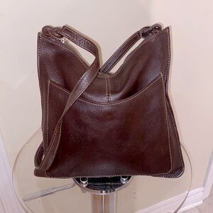 Genuine leather  unbranded bag w/silver tone zipper pull, knotted straps. 🤎